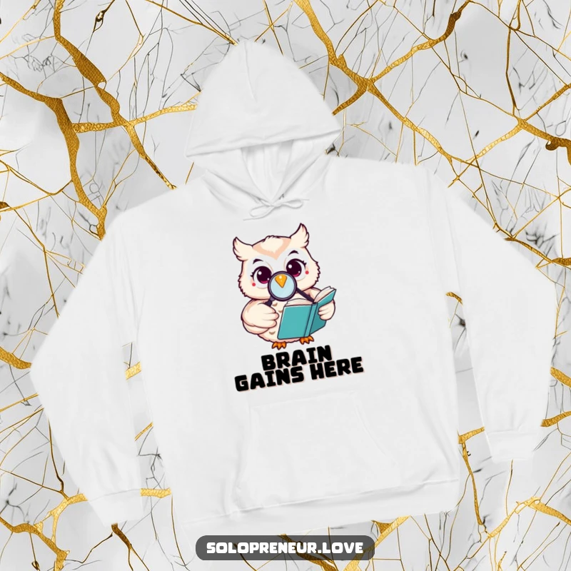 Funny happy owl hoodie featuring a character reading a book with a magnifying glass, offering warmth and intellectual charm.