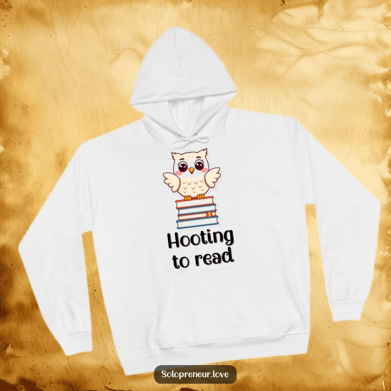 Funny hoodie featuring a happy owl character smiling on a stack of books, offering comfort and literary humor.