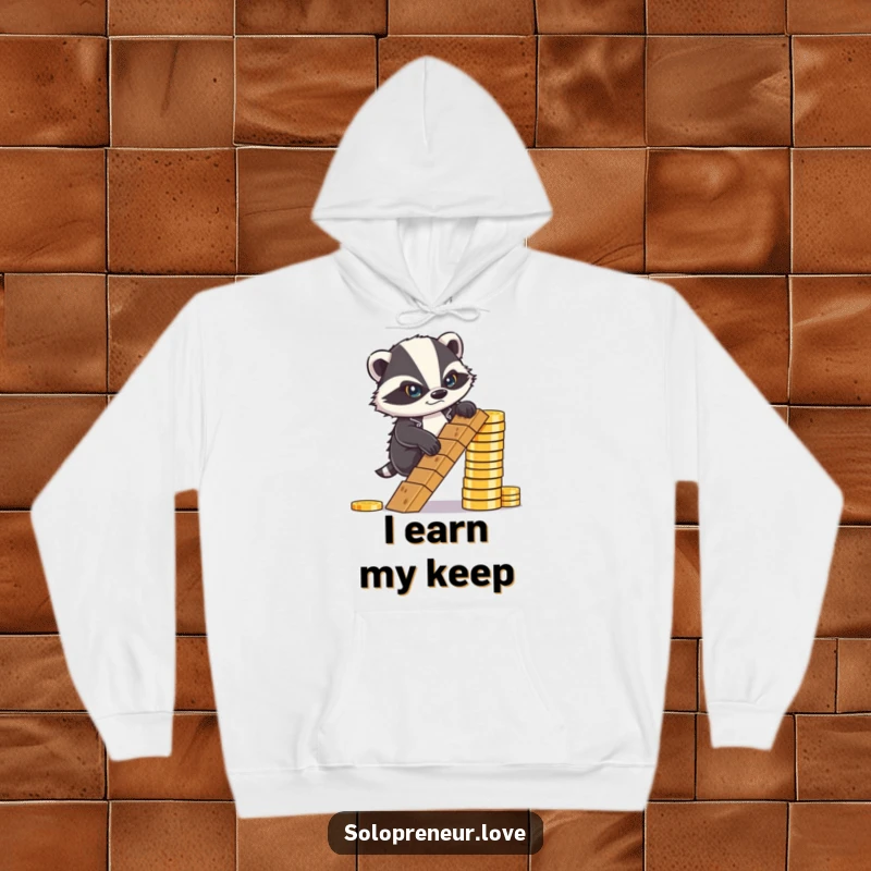 Funny Hoodie: A determined badger frowning, steadily climbing a ladder made entirely of coins, showing resolve.