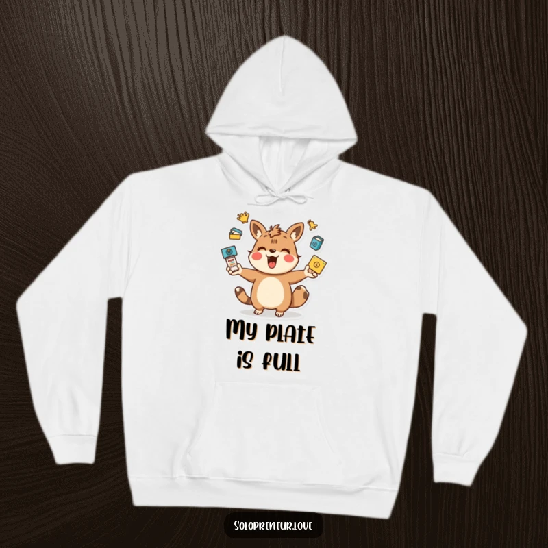 Funny juggling animal hoodie with a playful character energetically managing task icons, providing warmth and multitasking humor.