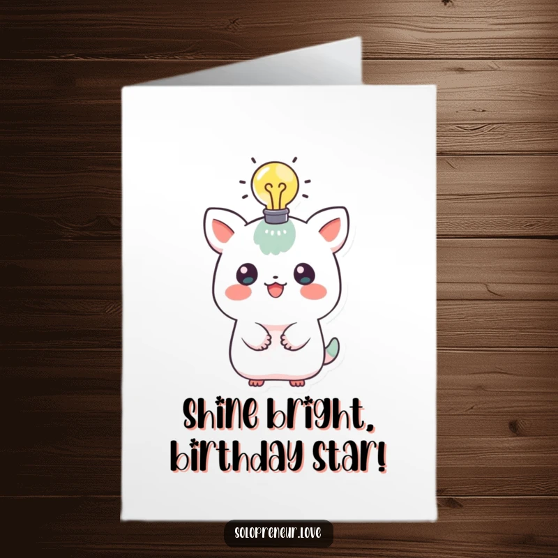 Funny Free Printable Birthday Card: A cute creature sports a lit lightbulb overhead, signifying a brilliant, happy birthday idea.