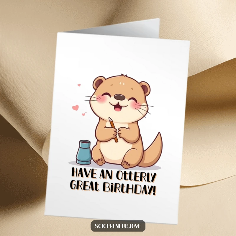 Funny Free Printable Birthday Card: A cheerful otter gleefully creates art on a digital canvas with a stylus, celebrating joyfully.