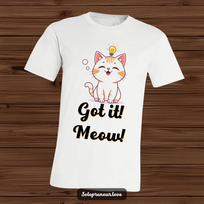 Funny T-Shirt: Playful cat character experiencing a lightbulb moment, symbolizing a sudden flash of genius.