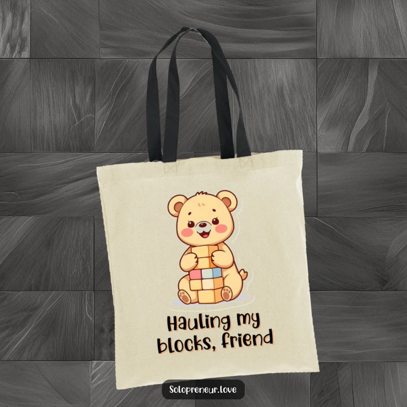 Funny tote bag featuring a happy bear cub building a small tower of blocks, perfect for carrying daily items with a touch of playful innocence.